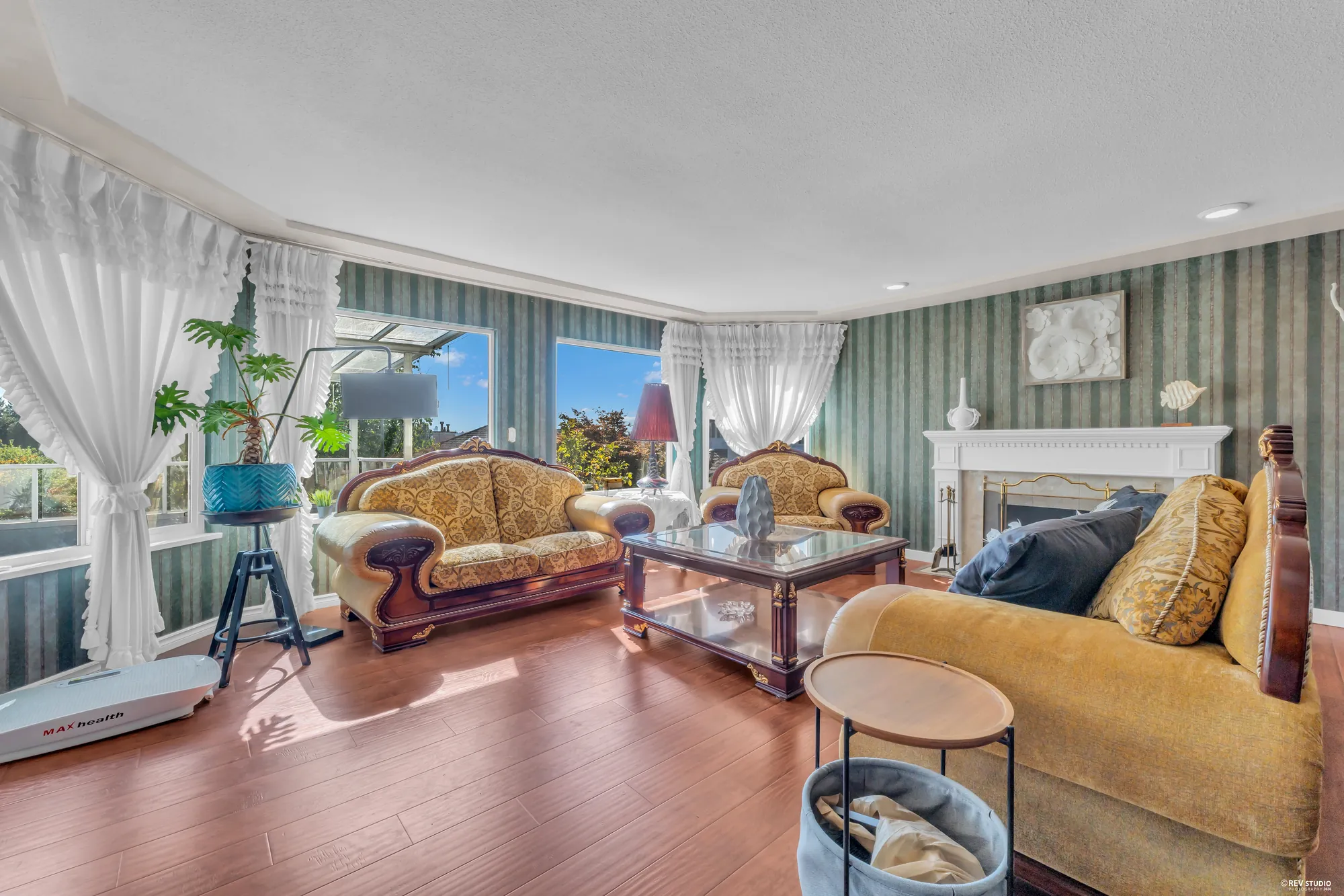 The living room toward the bay window and the dining room beyond